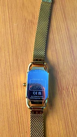 Gold-tone Coach women's wristwatch with mesh bracelet