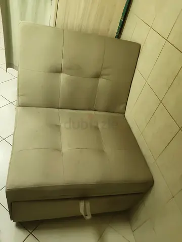 Beige single armless sofa chair / modular seat (used) sofa bed