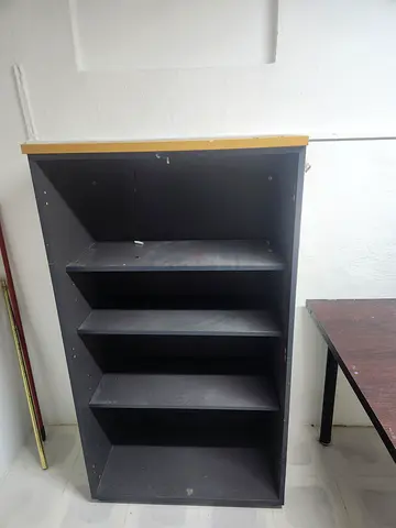 Black wooden shelving unit with 4 vertical compartments - good used condition