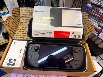 Steam Deck OLED handheld console — lightly used, complete in carrying case