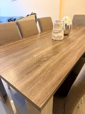 Wooden dining table with 8 upholstered chairs - good condition