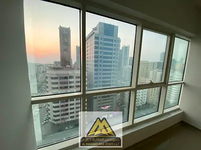 2 master bedrooms, separate hall, 3 baths, balcony, parking & central AC. Al Rashidiya 3 near Grand Mall. AED 48K, 4 payments.