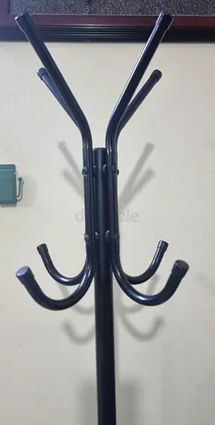 Black metal freestanding coat rack with multiple hooks