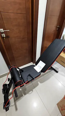 Adjustable workout bench with resistance bands - Excellent condition.