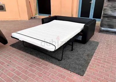 Black  leather sofa bed with mattress - good condition