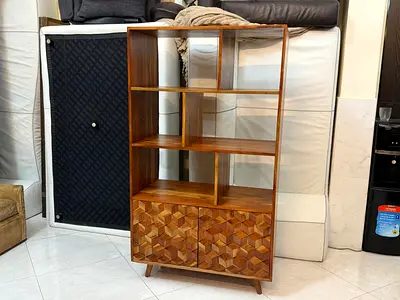 Mid-century wooden display shelf with patterned cabinet
