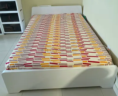 White queen bed with under-bed drawers, mattress included