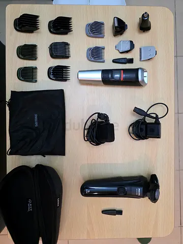 Philips electric shaver and hair clipper set with attachments — good condition.