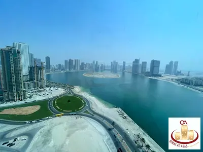 Two bedrooms and a living room for annual rent, overlooking Al-Khan Lake, first row from the corniche + parking spot