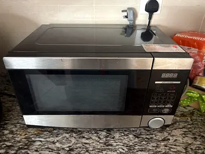 Used stainless steel microwave