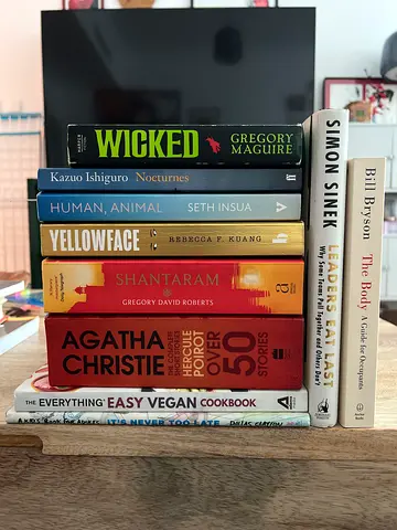 Collection of 9 assorted paperback books — fiction, non-fiction and cookbook
