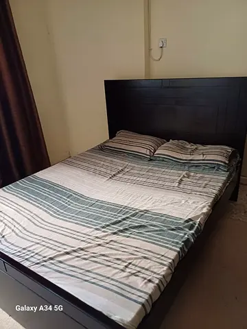 Dark wood double bed frame with headboard - good condition. (Negotiable)