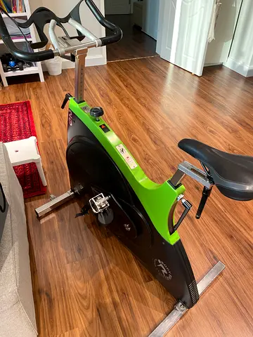 Used Indoor Spin Bike — Good Condition, Adjustable Seat & Handlebars.