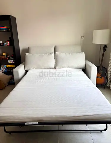 Light beige 2-seater sofa bed in good condition vimle