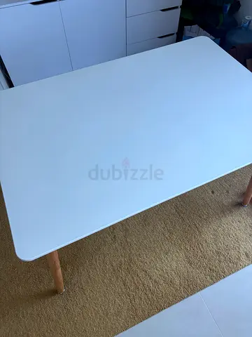 White table with wooden legs