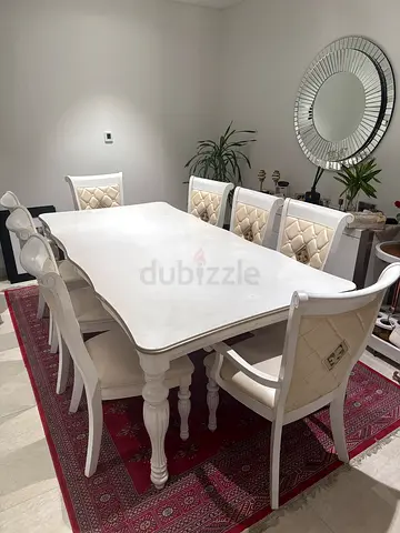 White wooden dining table with 8 upholstered chairs - elegant set