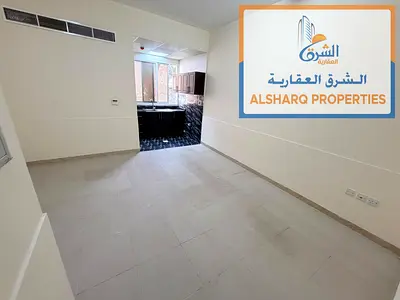 Spacious studio in Al Rashidiya 2, next to the Ladies' Park. Features a separate kitchen, central a