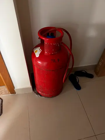 Full red LPG gas cylinder for home use