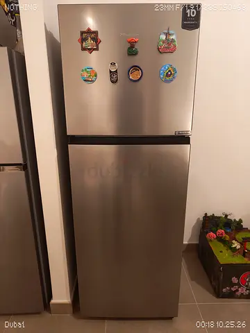 Stainless steel top-freezer refrigerator - good working condition (1 year only)