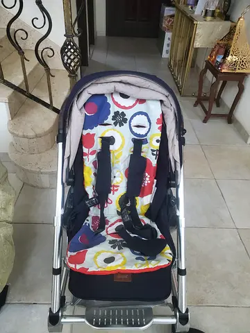 Lightweight standard stroller in good condition with colorful seat liner