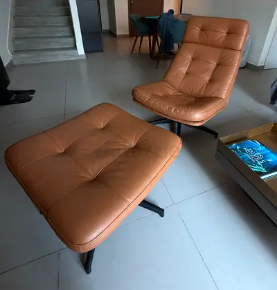 IKEA HAVBERG Leather Swivel Chair + Footstool – AED 1,500