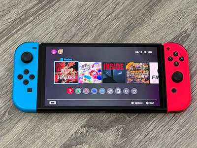Nintendo Switch OLED (Neon Red/Blue) + Super Mario Party + Just Dance 2022 + Mario Case