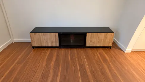 Low-profile TV Entertainment Unit with Wood Doors and Glass Center