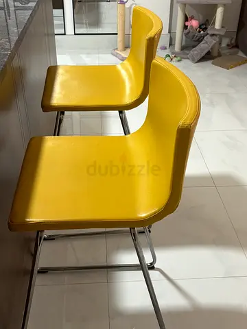 Set of 2 yellow mid-century modern bar stools with chrome frame