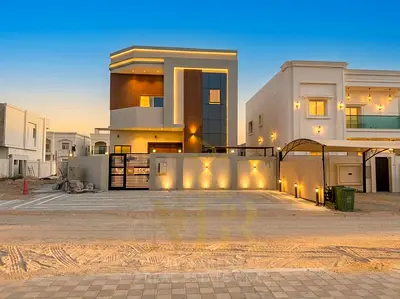 Luxury villa for sale in Al Yasmin with a modern design and high-end finishes, including air conditioning, ready for immediate occupancy.