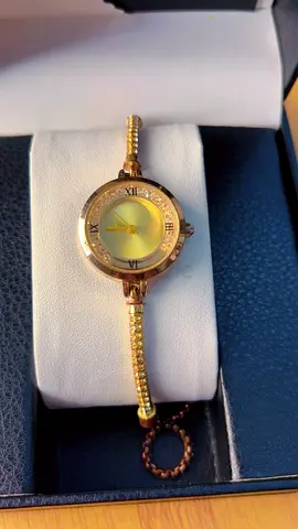 Gold-tone ladies wristwatch with beaded bracelet strap