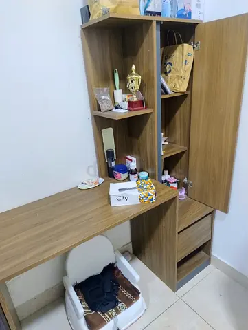 Wooden study desk with attached shelving and drawers - good condition