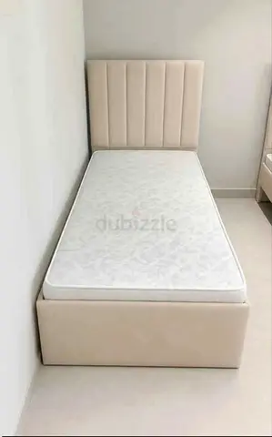 Single beige upholstered bed frame with mattress - good condition
