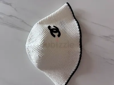 Chanel White knit bucket hat with black trim and logo