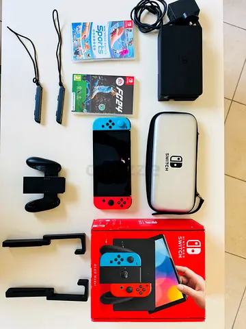 Nintendo Swatch OLED, Dock, Controllers and 2 Games with extra car holder with protective case