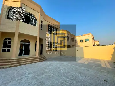 Villa for annual rent in Al Muwaihat 1, featuring 5 master bedrooms, with an area of ​​5,000 square feet.