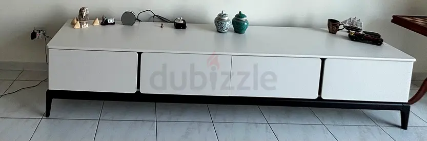 Low-profile modern TV cabinet / entertainment unit in white with black base