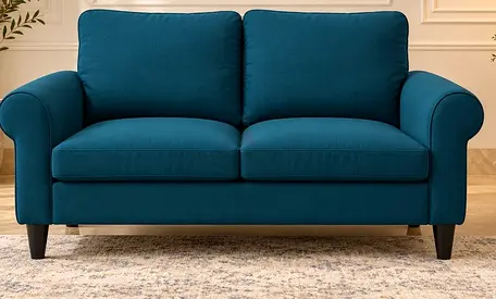 Two-seater teal fabric sofa in good condition
