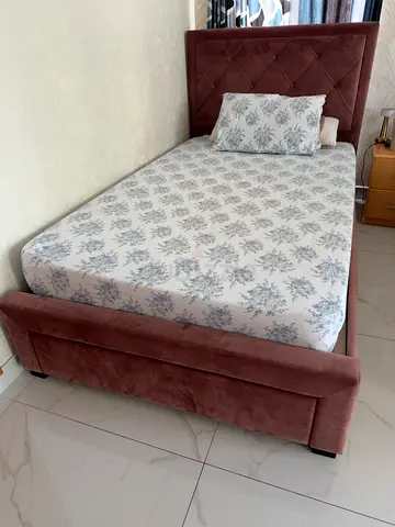 Single upholstered bed with headboard and storage, good condition