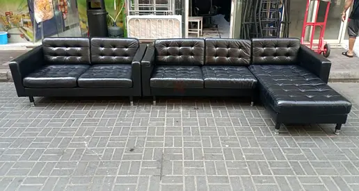 Black leather sectional sofa with chaise - 4-seater, good condition