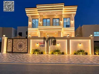 An exceptional villa for sale in the Al Zahia area, Ajman. It features 4 bedrooms, a *majlis* (reception area), two living rooms, and a maid’s room, a
