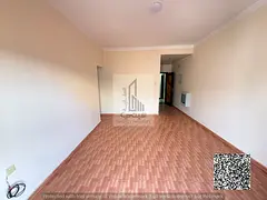 Two-bedroom apartment with a living room in Al Rawda 2, featuring 2 bathrooms, for 35,000 per year.