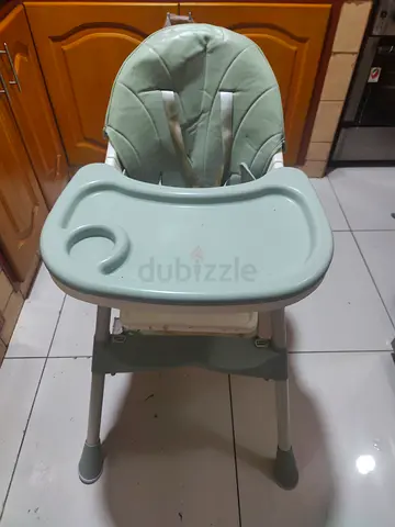 Used adjustable baby high chair - green, good condition