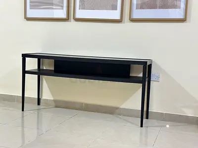 Slim black console table with lower shelf - good condition