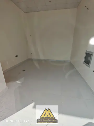 Prime, service-oriented location | Water and sewage connections inside the unit | Parking spaces in front of the shops | Annual rent: 20,000 AED | Pay