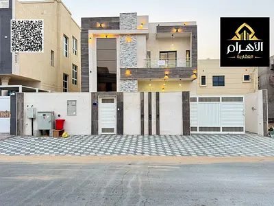 Modern villa (includes water, electricity, air conditioning, and furniture) – features a majlis, 2 living areas, and a spacious courtyard – freehold o