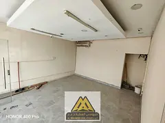Shop for annual rent in Al Muwaihat - Ajman | On a main street and front parking A great opportunity
