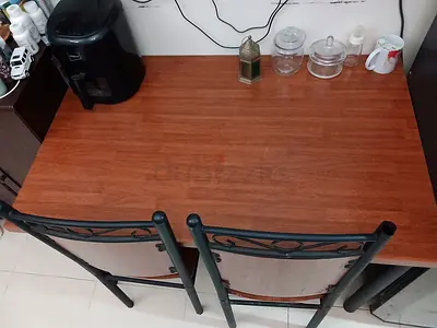 Solid wood dining table with four  chairs - good condition