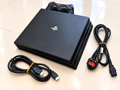 PlayStation 4 Pro with DualShock 4 and Cables - Good Condition 800 gb