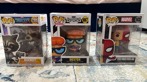 Three Funko Pop! Figures – Rocket (Guardians), Dexter (Cartoon Network), Peter Parker/Spider-Man