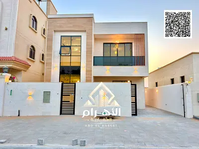 Luxury villa for sale in Al Yasmeen, featuring 6 master bedrooms, two floors, and a roof terrace. L